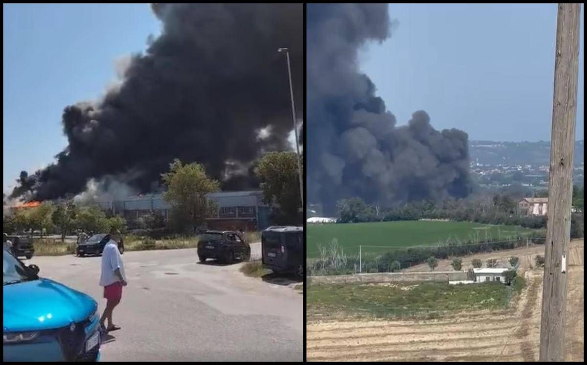 Fano, incendio nella zona industriale. Enorme nube di fumo nero -